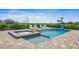 Inviting backyard oasis with a refreshing pool, spa, and lounge chairs at 159 Golden Noble St, Kissimmee, FL 34747