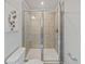 Large shower with glass enclosure and tile surround at 159 Golden Noble St, Kissimmee, FL 34747
