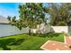Backyard with artificial turf, shed, and small patio at 1812 Hudson Ct, Kissimmee, FL 34759