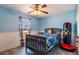 bedroom with a gray bed and blue walls at 1812 Hudson Ct, Kissimmee, FL 34759