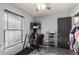 Small home office with treadmill, desk, and window at 1812 Hudson Ct, Kissimmee, FL 34759