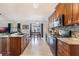 Modern kitchen featuring granite countertops and dark wood cabinets at 1812 Hudson Ct, Kissimmee, FL 34759