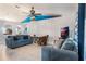 Living room with gray couches and a view into the kitchen at 1812 Hudson Ct, Kissimmee, FL 34759
