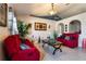 Living room with red couches, a coffee table, and decorative accents at 1812 Hudson Ct, Kissimmee, FL 34759