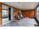 Screened porch with wood-paneled walls and patio furniture at 1812 Hudson Ct, Kissimmee, FL 34759