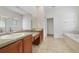 Primary bathroom with double sinks and garden tub at 1913 Cedar Arch Ln, Orlando, FL 32824