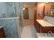 Updated bathroom with walk-in shower, soaking tub, and modern vanity at 306 Wild Olive Ln, Longwood, FL 32779