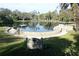 Serene community pond with stonework and dock at 306 Wild Olive Ln, Longwood, FL 32779