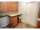 Laundry room with wooden cabinets and a folding counter at 306 Wild Olive Ln, Longwood, FL 32779