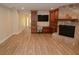 Bright living room with wood-look floors and built-in workspace at 306 Wild Olive Ln, Longwood, FL 32779