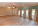 Open living area with hardwood floors and lots of natural light at 306 Wild Olive Ln, Longwood, FL 32779