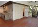 Outdoor kitchen with stone and bar area at 306 Wild Olive Ln, Longwood, FL 32779