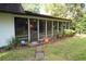 Screened porch with access to backyard at 306 Wild Olive Ln, Longwood, FL 32779