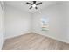 Simple bedroom with light walls and wood-look flooring at 3077 Norlina St, Deltona, FL 32738