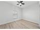 Well-lit bedroom featuring neutral walls and vinyl flooring at 3077 Norlina St, Deltona, FL 32738