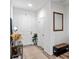 Bright and airy entryway with wood-look floors and a shoe bench at 308 Rustic Loop, Sanford, FL 32771