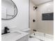 Modern bathroom with bathtub, shower, and black matte fixtures at 3149 W Washington St, Orlando, FL 32805