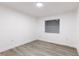 Bright bedroom with gray vinyl flooring and window blinds at 3149 W Washington St, Orlando, FL 32805