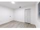 Simple bedroom with gray vinyl flooring, and white walls at 3149 W Washington St, Orlando, FL 32805