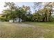 House with a large grassy front yard and mature trees at 3149 W Washington St, Orlando, FL 32805