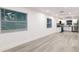 Open living area with gray vinyl flooring and white walls at 3149 W Washington St, Orlando, FL 32805
