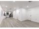 Bright and airy living room with modern gray vinyl flooring and recessed lighting at 3149 W Washington St, Orlando, FL 32805