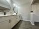 Modern bathroom with double vanity and large mirror at 3522 E Kaley Ave, Orlando, FL 32806