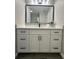 Modern bathroom with white vanity, quartz countertop, and black hardware at 3522 E Kaley Ave, Orlando, FL 32806