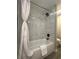 Updated bathroom with marble-look tile and a shower/tub combo at 3522 E Kaley Ave, Orlando, FL 32806