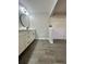 Modern bathroom with double vanity and large mirror at 3522 E Kaley Ave, Orlando, FL 32806