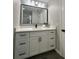 Modern bathroom with white vanity, quartz countertop, and black hardware at 3522 E Kaley Ave, Orlando, FL 32806
