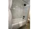 Updated bathroom with marble-look tile and a shower/tub combo at 3522 E Kaley Ave, Orlando, FL 32806