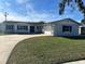 Newly renovated single-story home with a fresh coat of paint and landscaped lawn at 3522 E Kaley Ave, Orlando, FL 32806