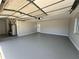 Garage with ample space, water heater, and door to backyard at 3522 E Kaley Ave, Orlando, FL 32806
