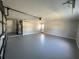 Spacious garage with painted floors and a door at 3522 E Kaley Ave, Orlando, FL 32806