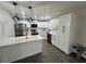 Modern kitchen with white shaker cabinets and stainless steel appliances at 3522 E Kaley Ave, Orlando, FL 32806