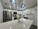 Modern kitchen with stainless steel appliances and white cabinets at 3522 E Kaley Ave, Orlando, FL 32806