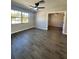 Spacious living room featuring tile flooring and a ceiling fan at 3522 E Kaley Ave, Orlando, FL 32806