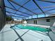 Relaxing kidney-shaped pool with screened enclosure at 3522 E Kaley Ave, Orlando, FL 32806