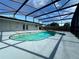 Relaxing kidney-shaped pool with screened enclosure at 3522 E Kaley Ave, Orlando, FL 32806