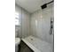 Large walk-in shower with marble tile and modern fixtures at 3522 E Kaley Ave, Orlando, FL 32806