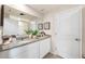 Double vanity bathroom with granite countertop and a large mirror at 428 Preston Cove Dr, Saint Cloud, FL 34771