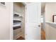 Well-organized linen closet with wire shelving, providing ample storage at 428 Preston Cove Dr, Saint Cloud, FL 34771