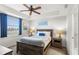 Bright bedroom with a queen bed and ample natural light at 4721 Clock Tower Dr # 204, Kissimmee, FL 34746