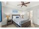 Cozy bedroom featuring a queen-size bed and ensuite bathroom access at 4721 Clock Tower Dr # 204, Kissimmee, FL 34746