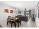 Dining area with a wooden table and view of living room at 4721 Clock Tower Dr # 204, Kissimmee, FL 34746