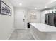 Modern kitchen with white cabinets and quartz countertops at 4721 Clock Tower Dr # 204, Kissimmee, FL 34746