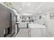 Open concept kitchen with stainless steel appliances and island at 4721 Clock Tower Dr # 204, Kissimmee, FL 34746