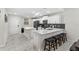 Modern kitchen with island, white cabinets, and stainless steel appliances at 4721 Clock Tower Dr # 204, Kissimmee, FL 34746