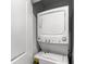 Convenient laundry closet with stackable washer and dryer at 4721 Clock Tower Dr # 204, Kissimmee, FL 34746